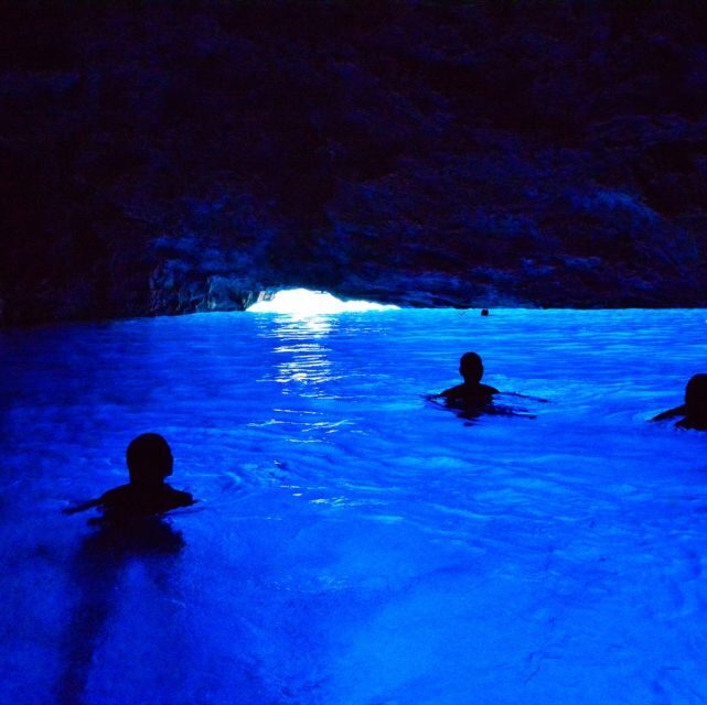 Dubrovnik: Blue & Green Caves Private Boat Tour with Drinks - The cruise out: bridge views and Grebeni Lighthouse photo stops