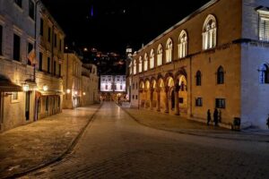 Dubrovnik By Night Walking Tour - Stradun Placa: The Main Street You’ll Learn to Read