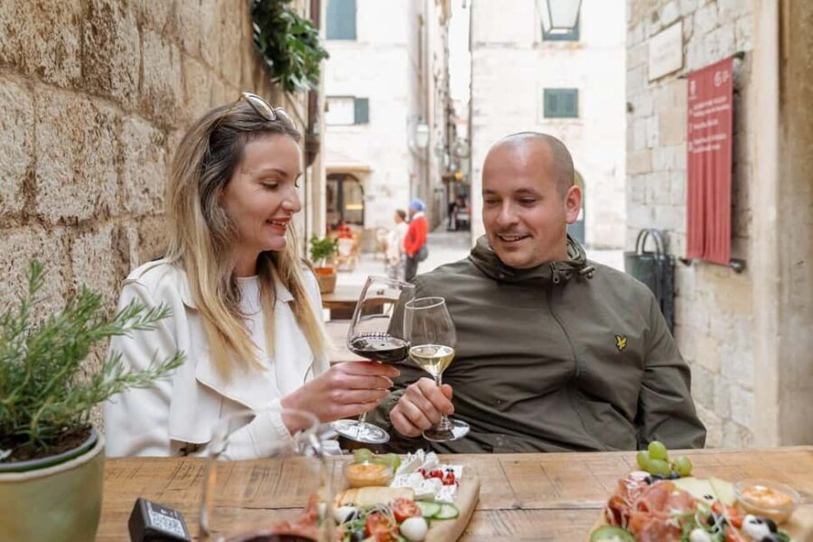 Dubrovnik Old Town: Night tour with History, Wine & Bites - The wine bar finish: 2 glasses plus cheese, prosciutto, olives, bread